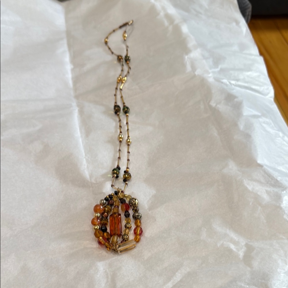 Gold tone and Orange Necklace with Intricate Pendant